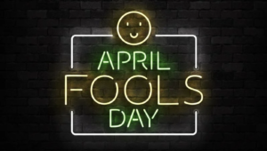 Neon sign that reads "April Fools Day) with a smiley face