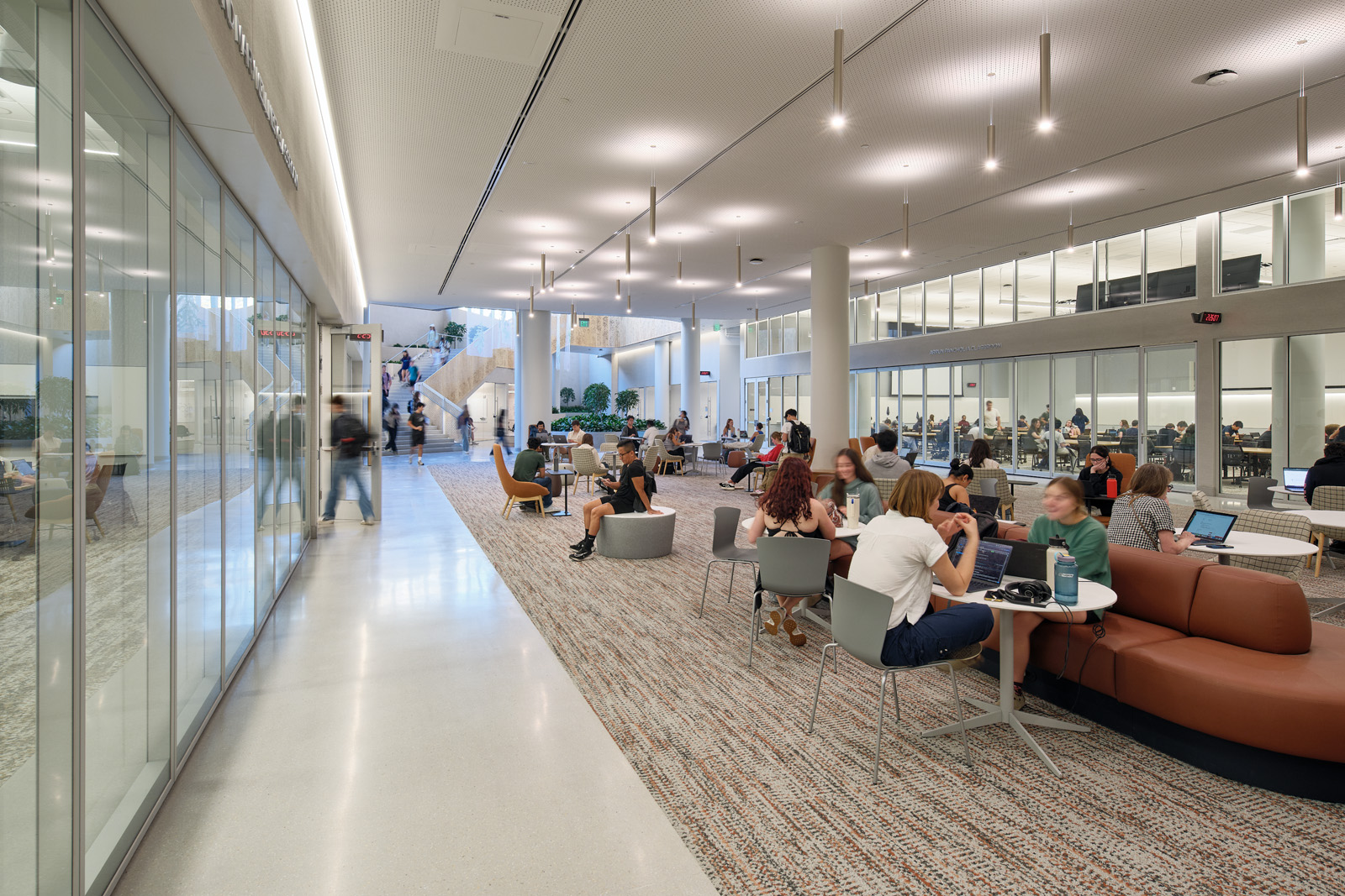 Photo of students sitting at tables and working together