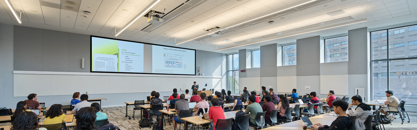 Photo of students sitting in a classroom listening to an instructor