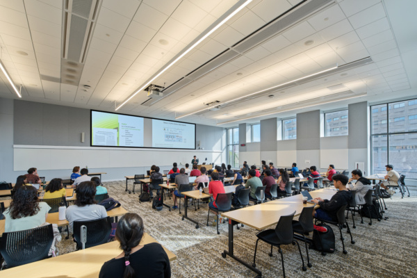 Photo of students sitting in a classroom listening to an instructor
